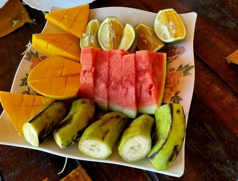 A platter of mango, watermelon, plantain and lime